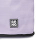 Close-up of The Brooke Tote by BRNG Bag in lavender, featuring a black-and-white square BRNG logo near the bottom corner and black trim along the edge, showcasing its stylish design.